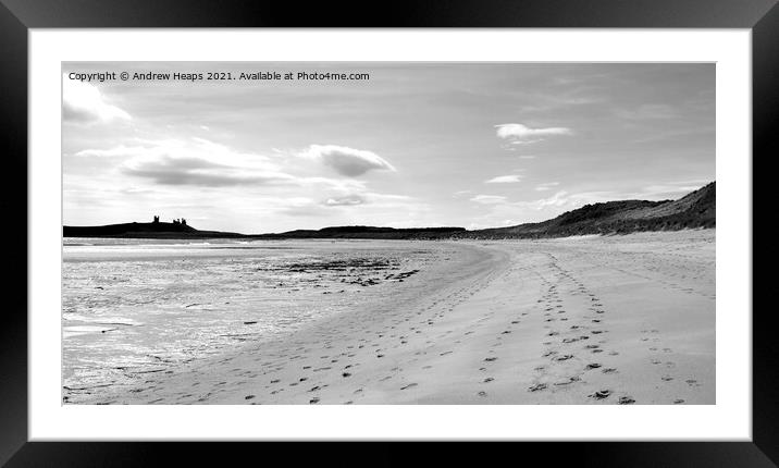 Footprints towards Dunstanburgh castle Framed Mounted Print by Andrew Heaps
