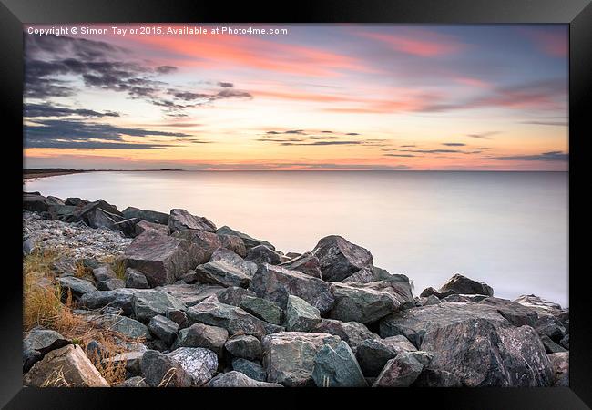  Brancaster sunset on the rocks, Norfolk Framed Print by Simon Taylor