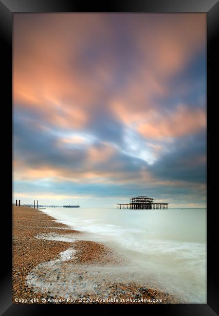 Brighton Piers at sunrise Framed Print by Andrew Ray