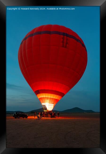 Hot-Air Balloon preparing for take-off Framed Print by Howard Kennedy