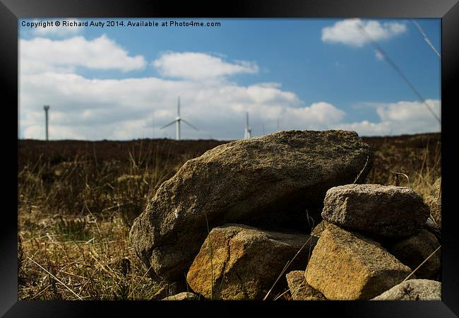  Rocks and Wind turbines  Framed Print by Richard Auty