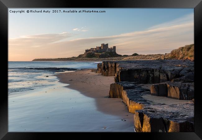 Bamburgh Castle Framed Print by Richard Auty