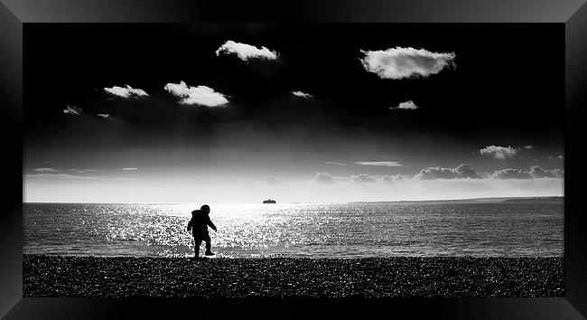 The Boy on The Beach Framed Print by Simon Rutter