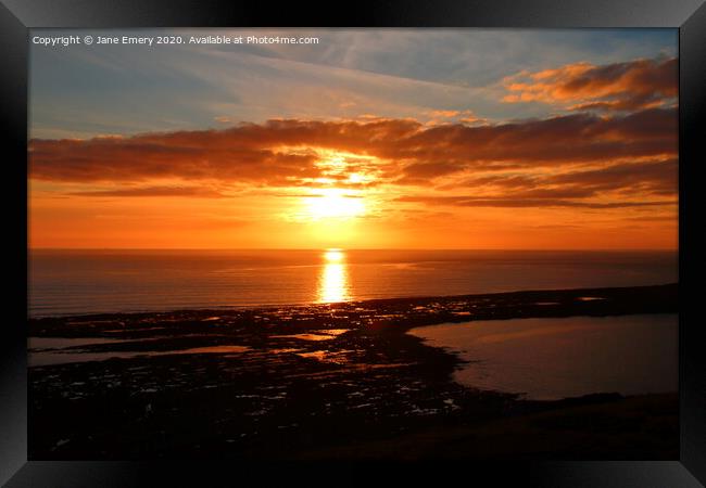 Sky, setting  sun, overlooking the causeway at Rhossilli Framed Print by Jane Emery
