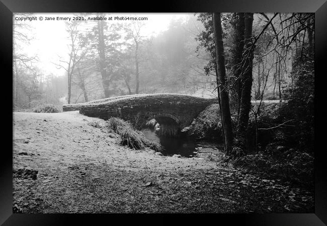 Bridge in the snow Framed Print by Jane Emery