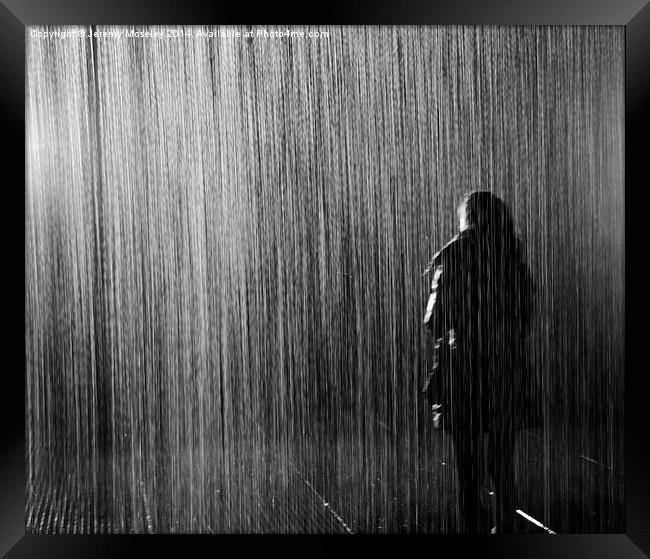 Lone figure standing in the rain Framed Print by Jeremy Moseley