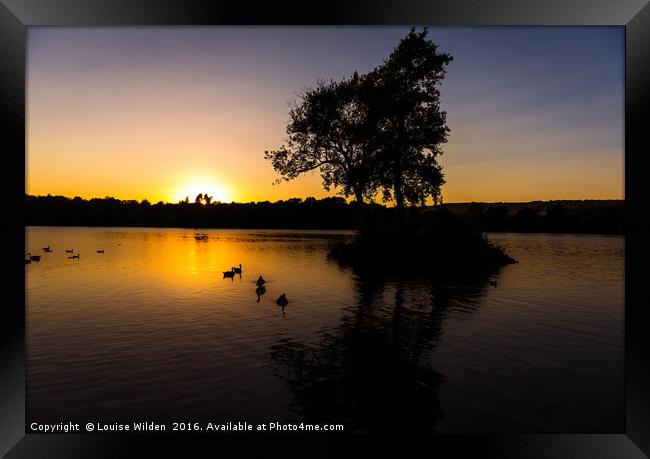 Sunsets on the lake Framed Print by Louise Wilden