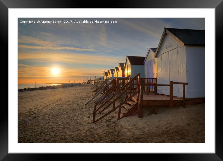 Old Felixtowe beach hut Sunset Framed Mounted Print by Antony Burch