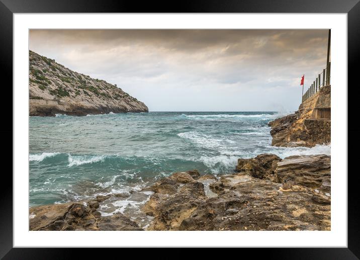 Red flag flying in Majorca Framed Mounted Print by Jonathon barnett