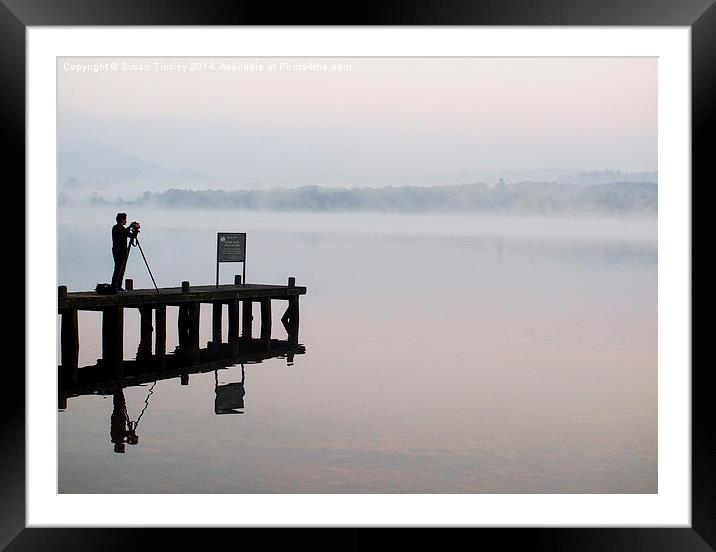 Photographer on a jetty Framed Mounted Print by Susan Tinsley