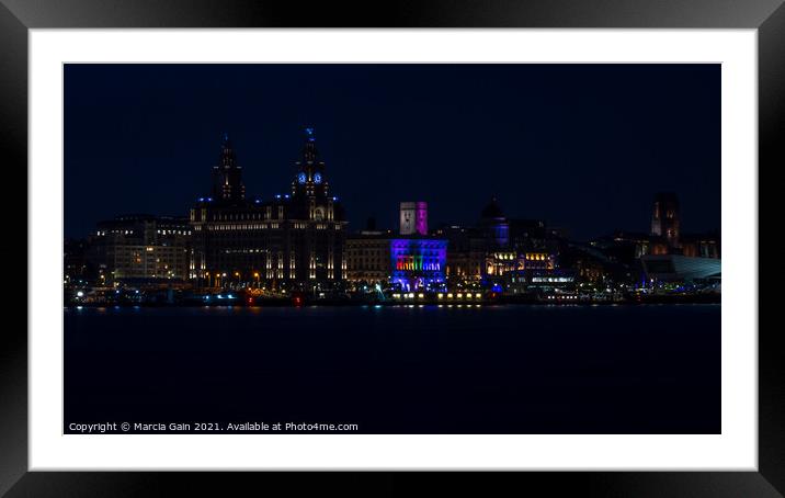 The Liverpool skyline lit up at night Framed Mounted Print by Marcia Reay
