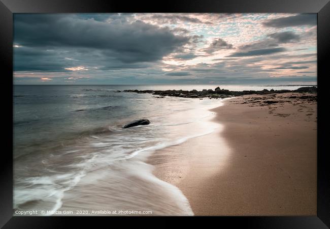 Northumberland coast at sunrise Framed Print by Marcia Reay
