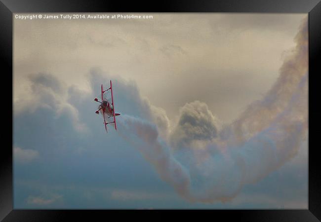 A smoking biplane corksrews in heavy cloud  Framed Print by James Tully