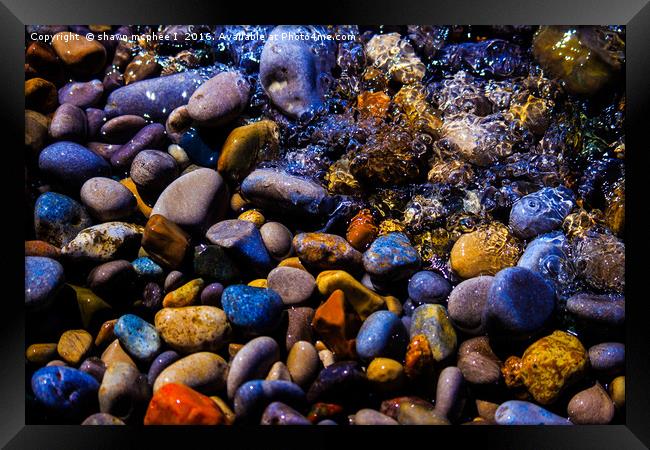  Waves over Multi color rocks Framed Print by shawn mcphee I