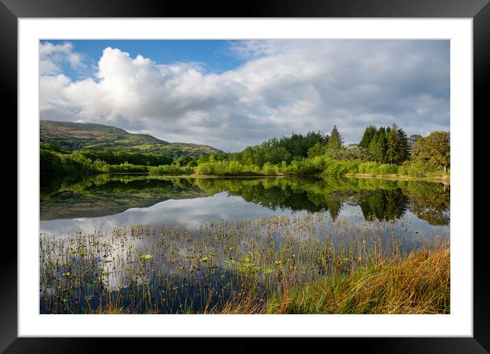 Reflections in a lake in North Wales Framed Mounted Print by Andrew Kearton