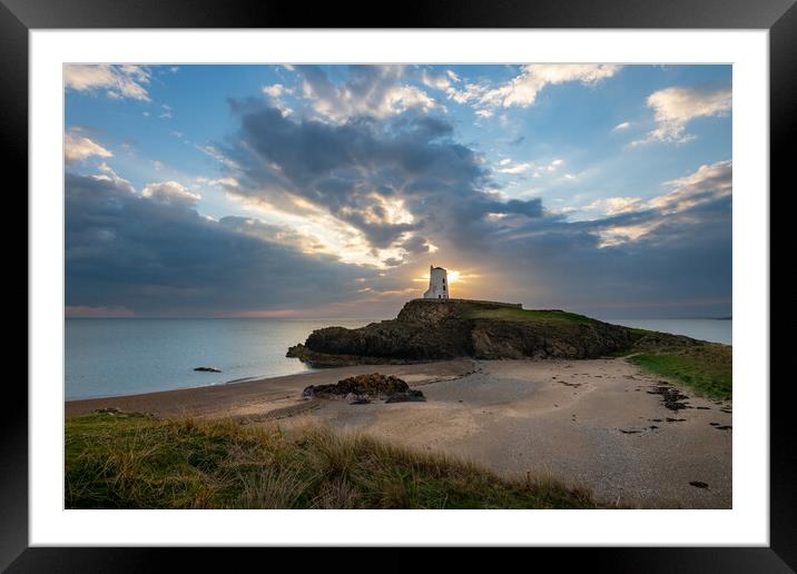 Sun setting behind Twr Mawr Lighthouse, Wales Framed Mounted Print by Andrew Kearton