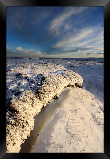 Last sunlight on the snowy moors Framed Print by Andrew Kearton