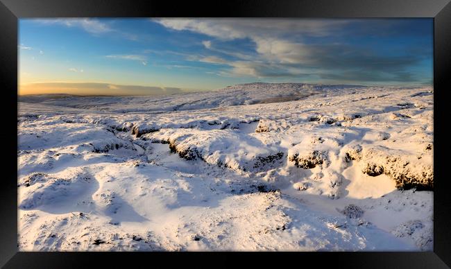 Sunset on the snowy moors Framed Print by Andrew Kearton