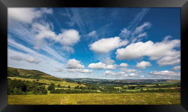 Fluffy clouds over Glossop Framed Print by Andrew Kearton