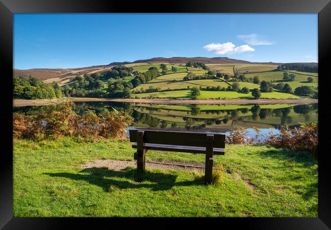 A wooden bench with views of Ladybower reservoir Framed Print by Andrew Kearton