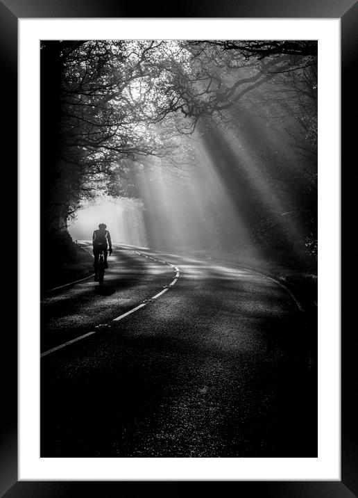 Cycling through the mist Framed Mounted Print by Jonathan Smith