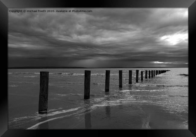 Stormy sky over Brean sands Framed Print by michael freeth