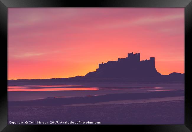Bamburgh Castle Sunrise Silhouette Framed Print by Colin Morgan