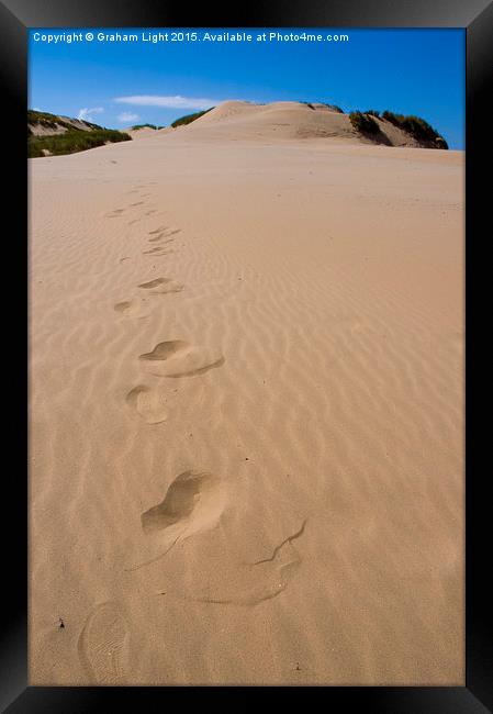  Footsteps in the sand Framed Print by Graham Light