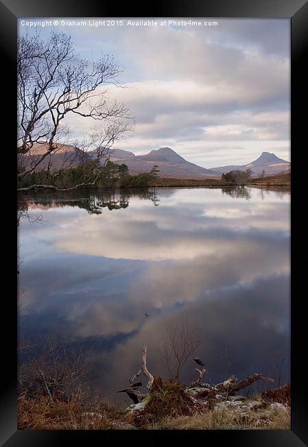  Reflections across the Loch Framed Print by Graham Light