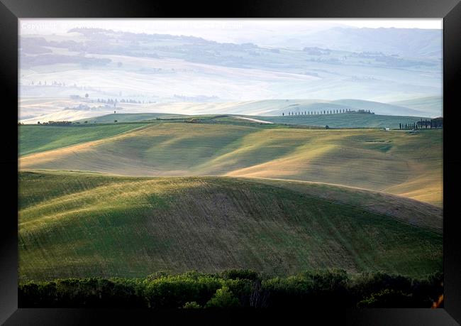 Early morning light on the rolling hills of Tuscan Framed Print by Graham Light