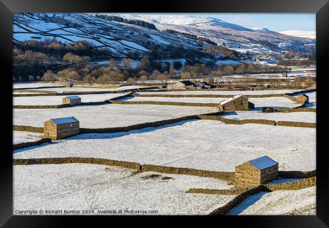 The Barns at Gunnerside in Swaledale on a bright, snowy winter's Framed Print by Richard Burdon