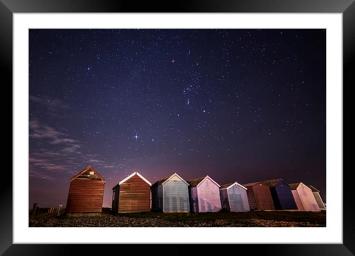 Orion over beach huts Framed Mounted Print by Chris Nesbit