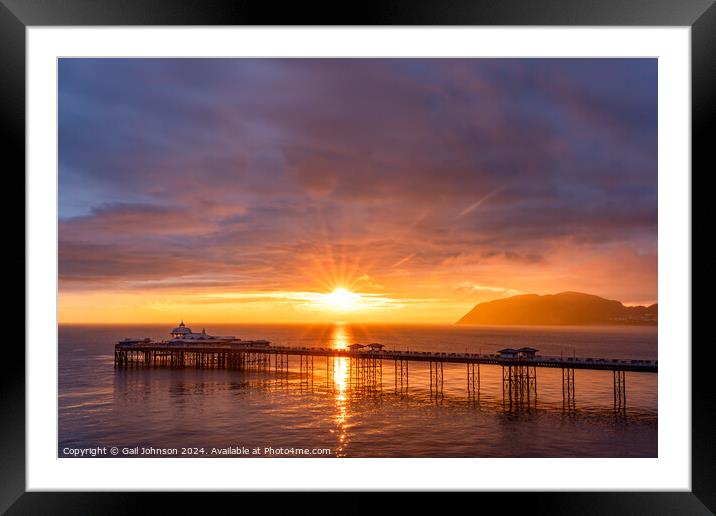 Sunrise over llandudno Pier with the tide in  Framed Mounted Print by Gail Johnson