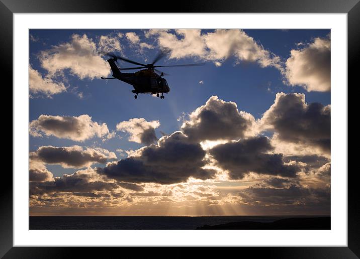 helicopter in sunbeams Framed Mounted Print by Gail Johnson