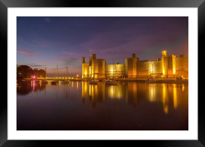 Caernarfon Castle at dusk with yachts floating at  Framed Mounted Print by Gail Johnson