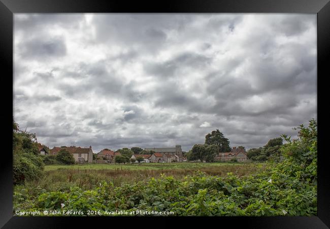 Thornham Norfolk under a leaden sky Framed Print by John Edwards