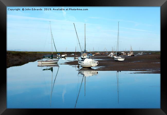 Reflections at Brancaster Staithe Framed Print by John Edwards