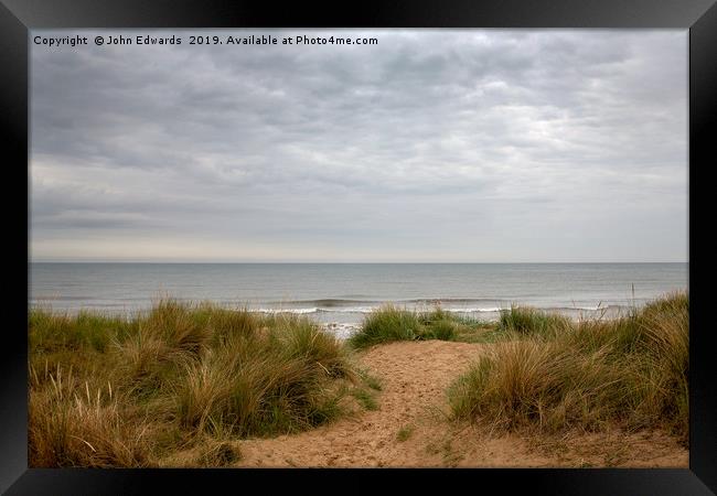 Marram and the sea Framed Print by John Edwards