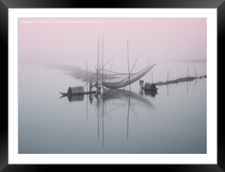 Two fishermen attend to their nets Framed Mounted Print by Peter Jones