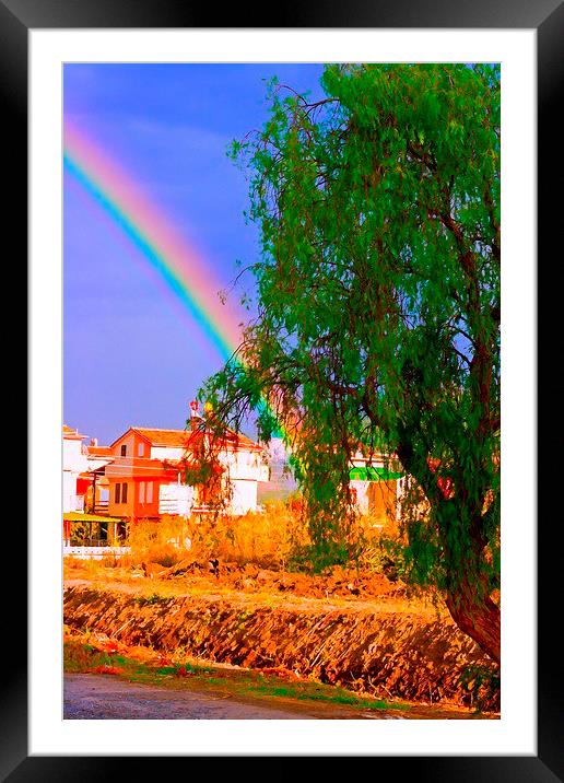 A digital painting of a rainbow over villas in the Framed Mounted Print by ken biggs