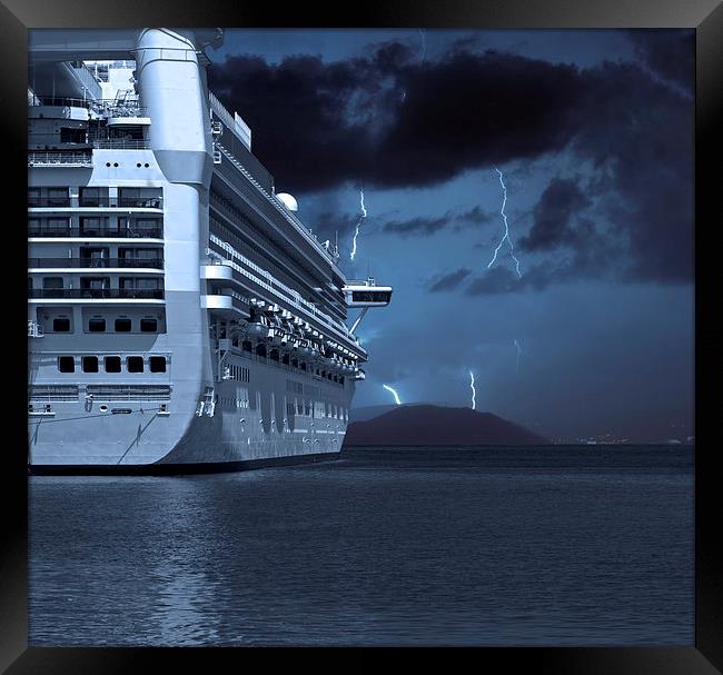 Cruise ship with lightning strikes in distance Framed Print by ken biggs