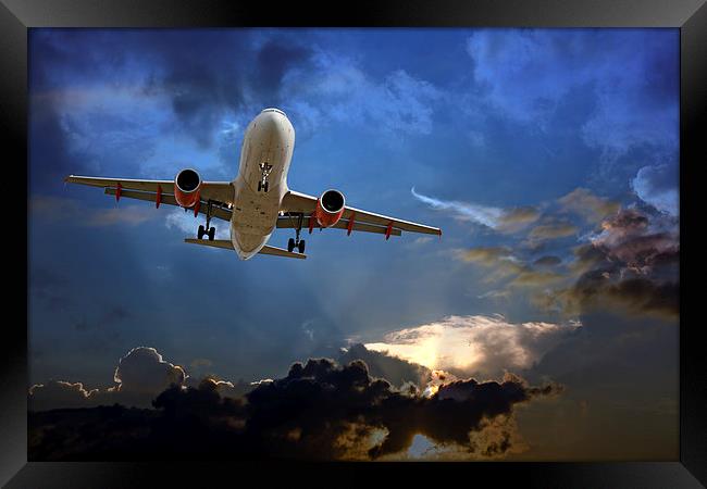 Passenger plane on final approach, against a storm Framed Print by ken biggs