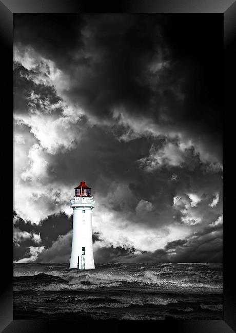 Lighthouse with approaching dramatic storm clouds Framed Print by ken biggs