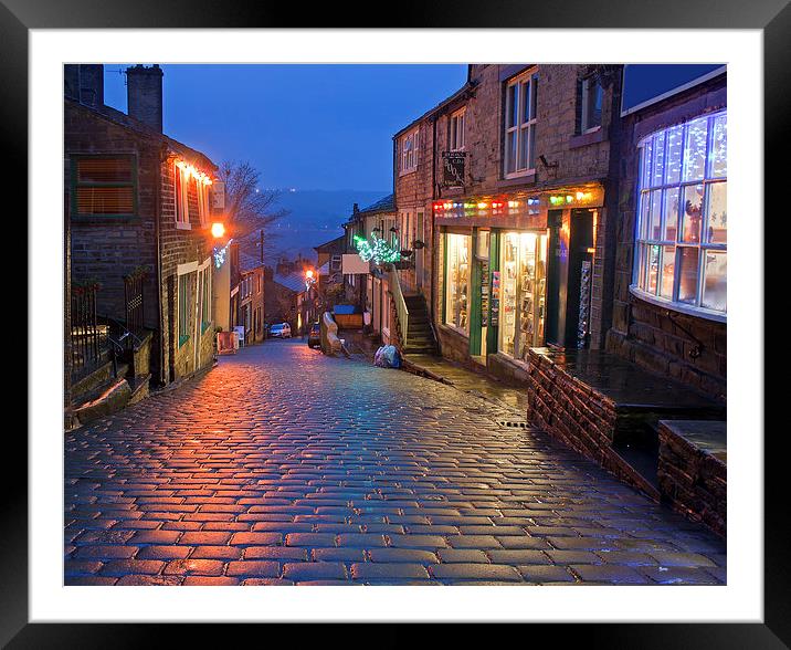 Main Street in Haworth, Yorkshire, UK, at Christma Framed Mounted Print by ken biggs
