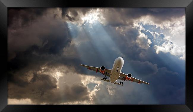 Passenger plane on final approach, against a storm Framed Print by ken biggs