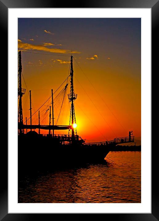 a ship in silhouette at sunset  Framed Mounted Print by ken biggs