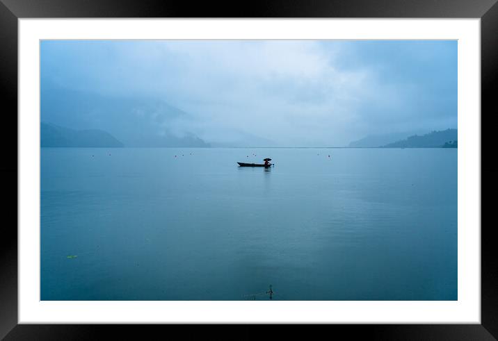 boatman fishing on phewa lake Framed Mounted Print by Ambir Tolang