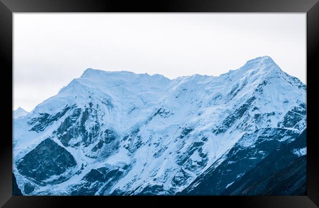  snow covered mountain range Framed Print by Ambir Tolang