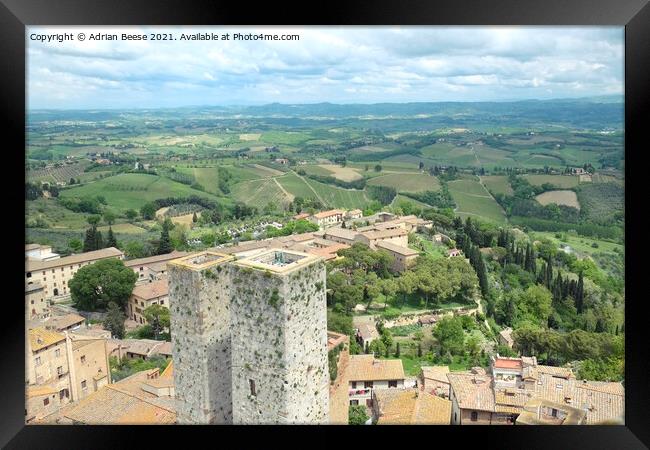 San Gimignano and the Tuscan countryside Framed Print by Adrian Beese