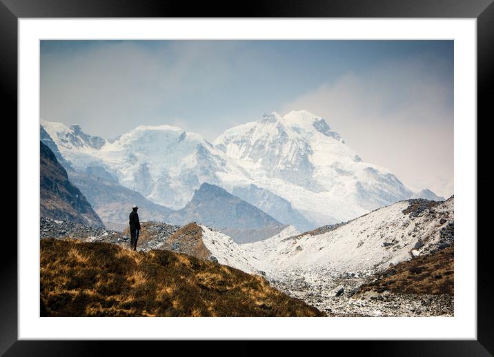 A man contemplates the size of Kanchenjunga Framed Mounted Print by Brent Olson